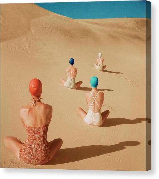 Models Sitting On Sand Dunes Canvas Art Print by Clifford Coffin