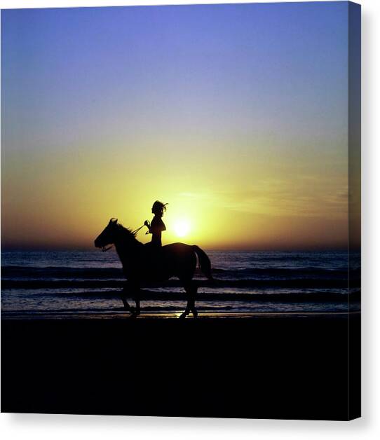 Margaux Hemingway on Horseback Canvas Art Print by Francesco Scavullo