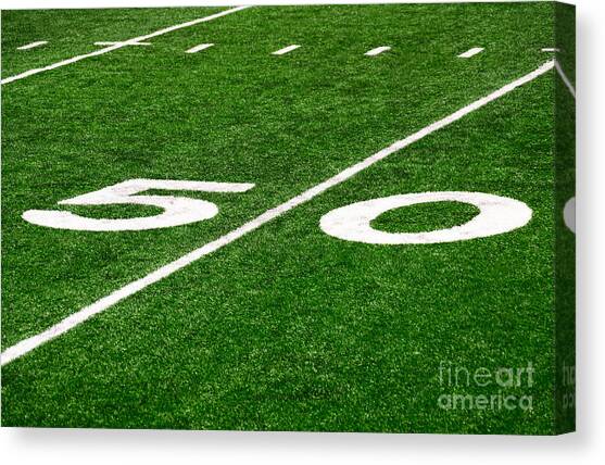 50 Yard Line on Football Field Canvas Art Print by Paul Velgos