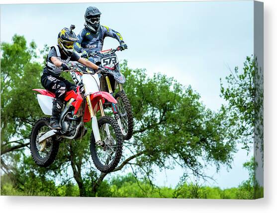 Motocross Battle Canvas Art Print by David Morefield