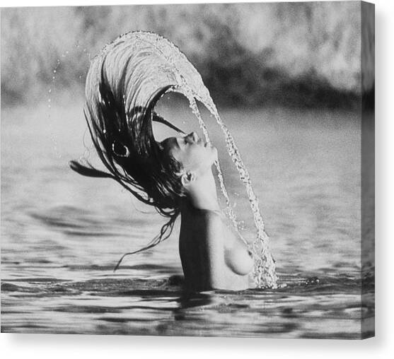 Marisa Berenson Flipping Her Hair In Water Canvas Art Print by Arnaud de Rosnay