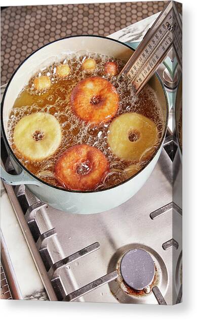 Donuts Frying Canvas Art Print by Emma Fishman