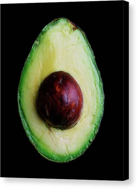 An Avocado Canvas Art Print by Romulo Yanes