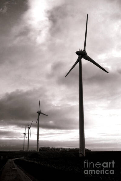 Wind Turbines Under Moody Skies Poster