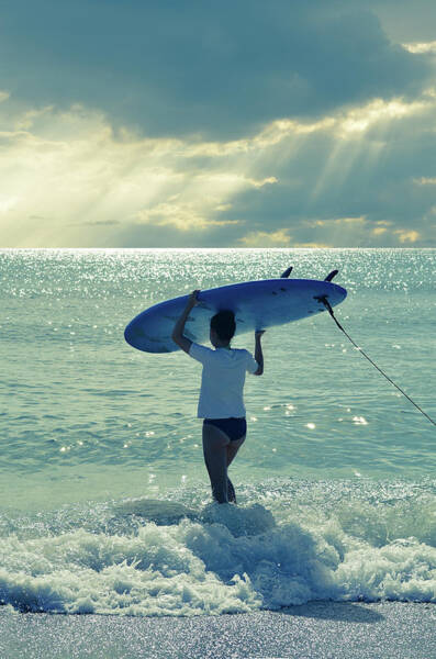Surfer Walking into the Ocean Poster