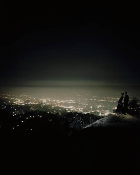 Couple Overlooking City Lights at Night Poster