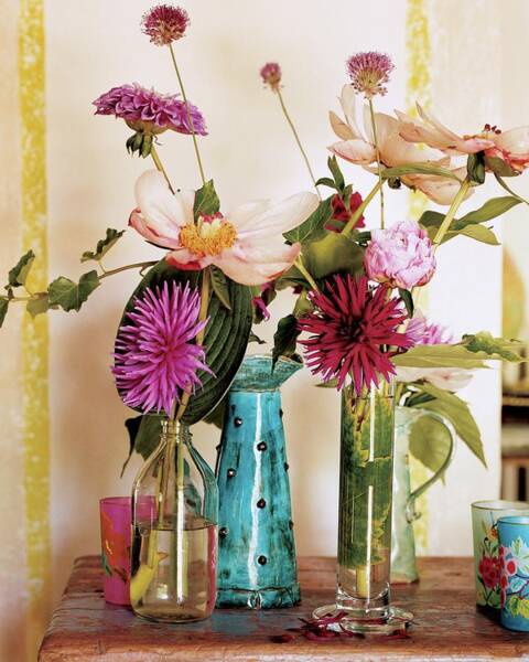 Vibrant Floral Arrangement in Glass Vases Poster