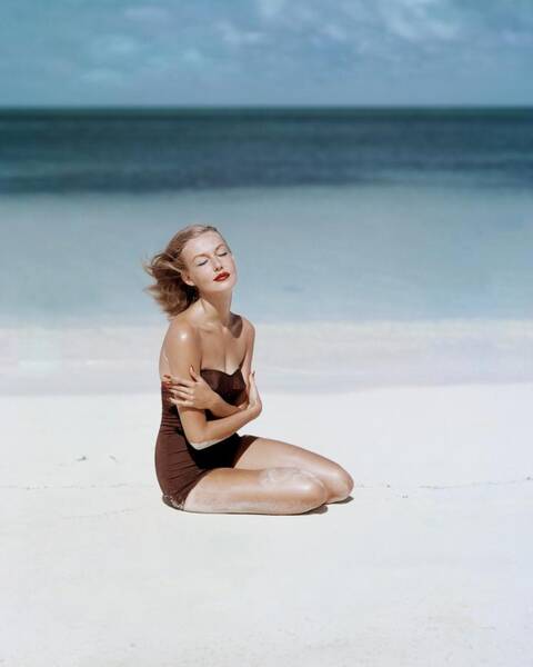 Woman Relaxing on a Sunny Beach Poster
