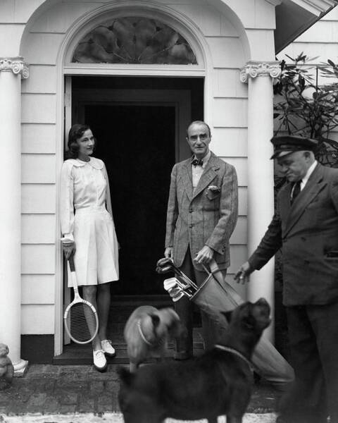 Elegant Couple with Tennis Gear Poster