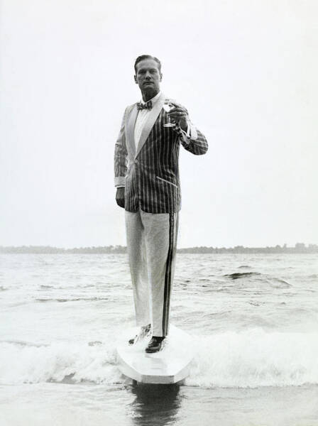 Man in Striped Suit on Surfboard Poster