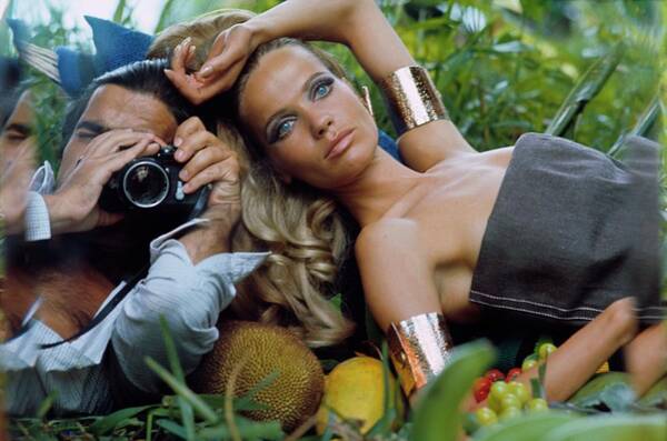 Model and Photographer in Tropical Setting Poster