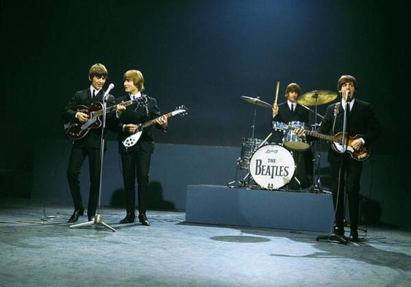 The Beatles Performing On Stage Poster
