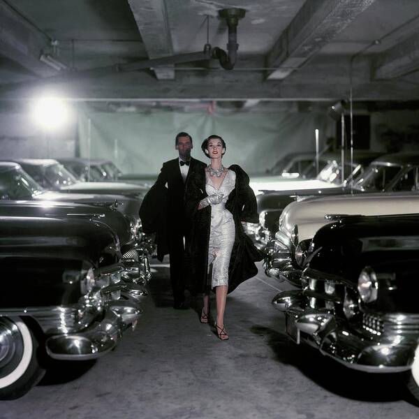 Elegant Couple in Vintage Car Garage Poster