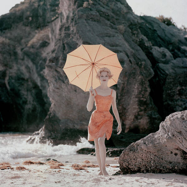Woman with Orange Umbrella on Beach Poster