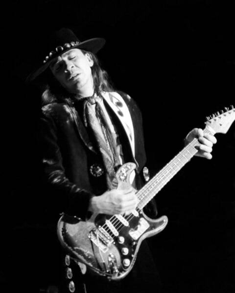 Guitarist in Black Hat Performing Wall Art