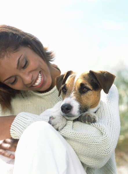 Togetherness Wall Art featuring the photograph Young Woman Holding Jack Russell by Todd Pearson