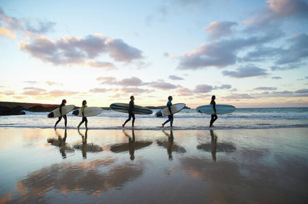 Surfers Walking at Sunset Wall Art