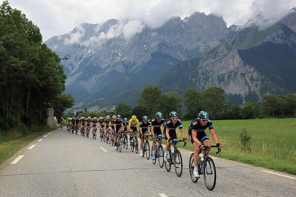 Cyclists Racing Through Scenic Mountains Wall Art