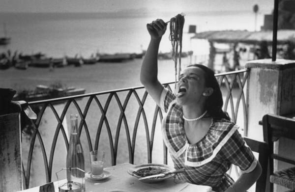 Woman Enjoying Spaghetti by the Sea Wall Art