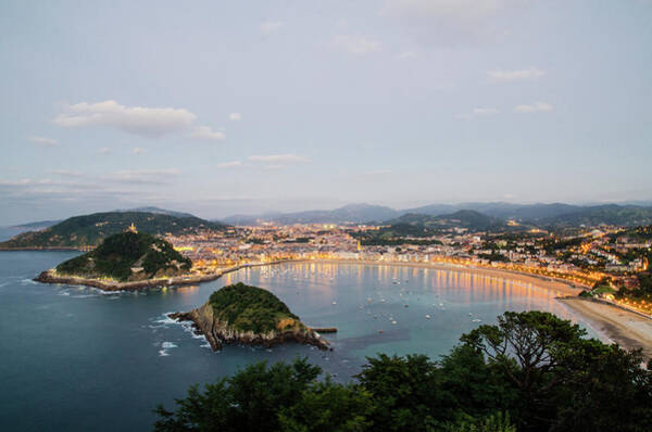 Sunset Over Coastal City Wall Art