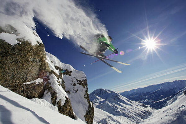 Skier Mid-Air Over Snowy Mountain Wall Art