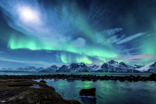 Aurora Borealis Over Snowy Mountains Photograph