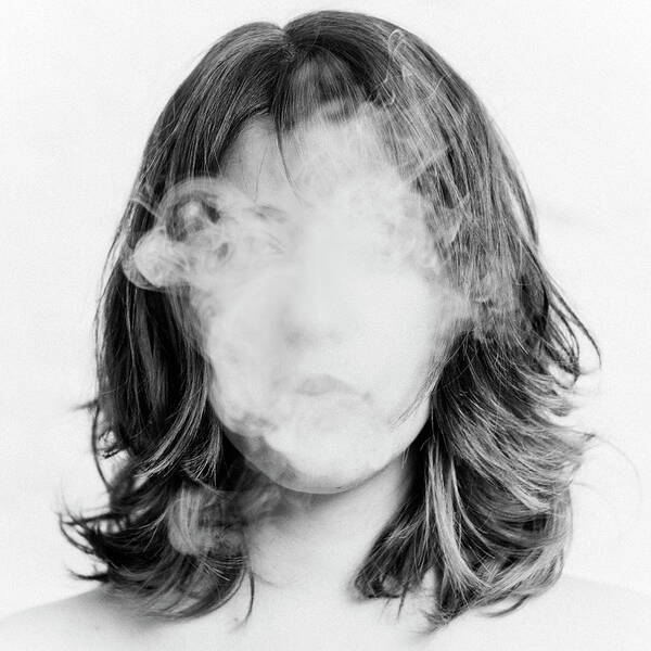 Woman's Face Obscured by Smoke Wall Art