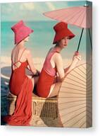 Elegant Beach Fashion with Straw Hats Canvas Print by Louise Dahl-Wolfe