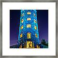 Illuminated Stone Tower at Night Framed Print