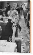 Smiling Woman in a Restaurant Wood Print by Arthur Elgort
