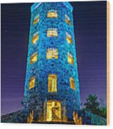 Illuminated Stone Tower at Night Wood Print
