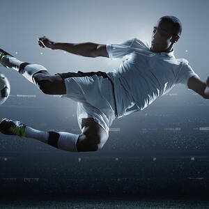 Soccer Player Kicking Ball In Stadium #4 by Dmytro Aksonov