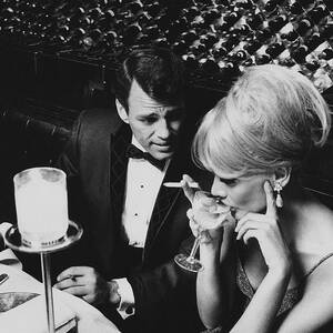 A Glamorous 1960s Couple Dining by Horn & Griner A Glamorous 1960s Couple Dining by Horn & Griner