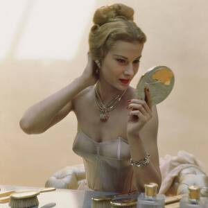 A Model At A Dressing Table by John Rawlings