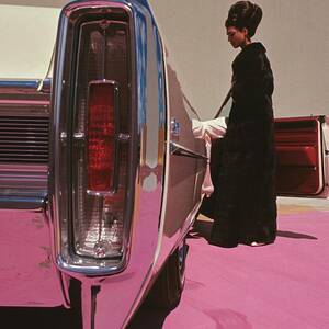 A Model Wearing Emeric Partos Entering A 1965 by Gene Laurents