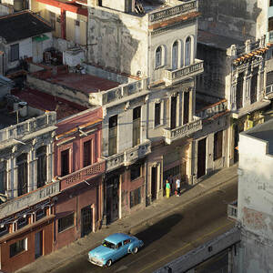 A Vintage Car In The Street Of Old by Buena Vista Images A Vintage Car In The Street Of Old by Buena Vista Images
