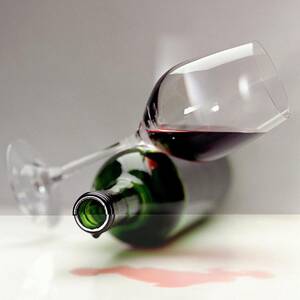 A Wine Bottle And A Glass Of Wine by Romulo Yanes A Wine Bottle And A Glass Of Wine by Romulo Yanes