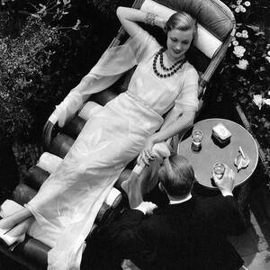 A Woman In A Chiffon Tea Gown In A Chaise Longue by The 3