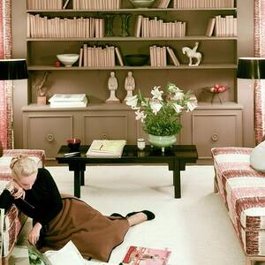 A Woman Reading Magazines On The Floor by Haanel Cassidy