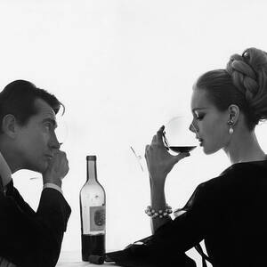Man Gazing at Woman Sipping Wine by Bert Stern