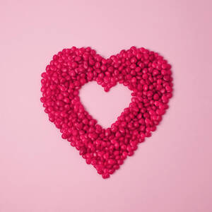 Red Cinnamon Candies In The Shape Of A by Juj Winn