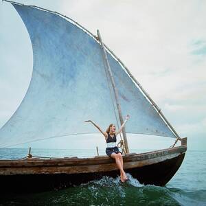 Veruschka Von Lehndorff Sitting On Edge by Franco Rubartelli