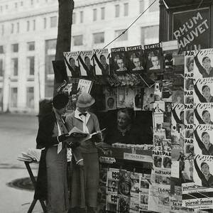 Women At A Newsstand In Paris by George Hoyningen-Huene Women At A Newsstand In Paris by George Hoyningen-Huene