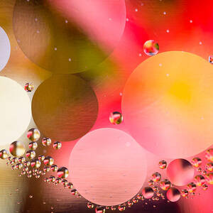 Macro shot of abstract oil in water droplets by Steven Heap