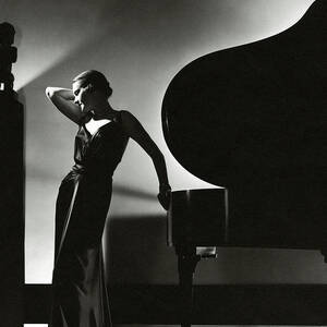 Margaret Horan Posing Beside A Piano by Edward Steichen