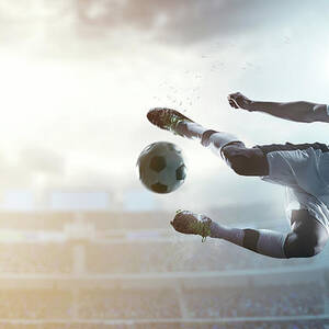 Soccer Player Kicking Ball In Stadium #9 by Dmytro Aksonov
