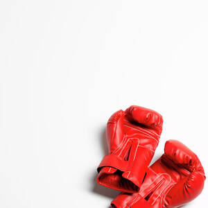 Boxing Gloves On White Background by Peter Dazeley