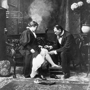Doctor Vaccinating Young Ladys Leg by Bettmann