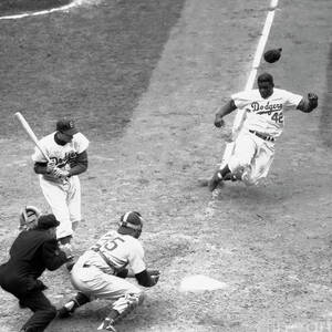 Dodger Jackie Robinson Stealing Home by Bettmann
