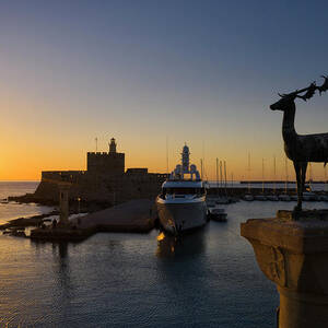 Greece, Greek Islands, Aegean, Levantine Sea, Sporades Islands, Dodecanese, Rhodes Island, Rhodes, Statue Of Deer & Fortress Of St. Nicholas In Port Of Mandraki In Rhodes by Massimo Ripani